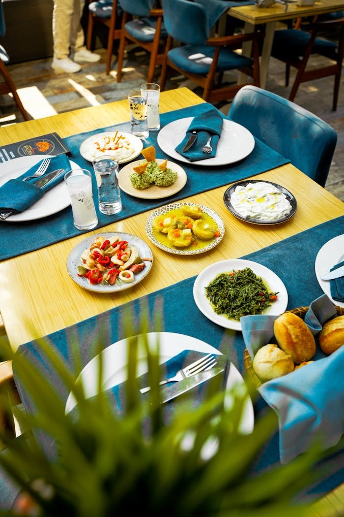 A vibrant Mediterranean spread with various dishes on a restaurant table.